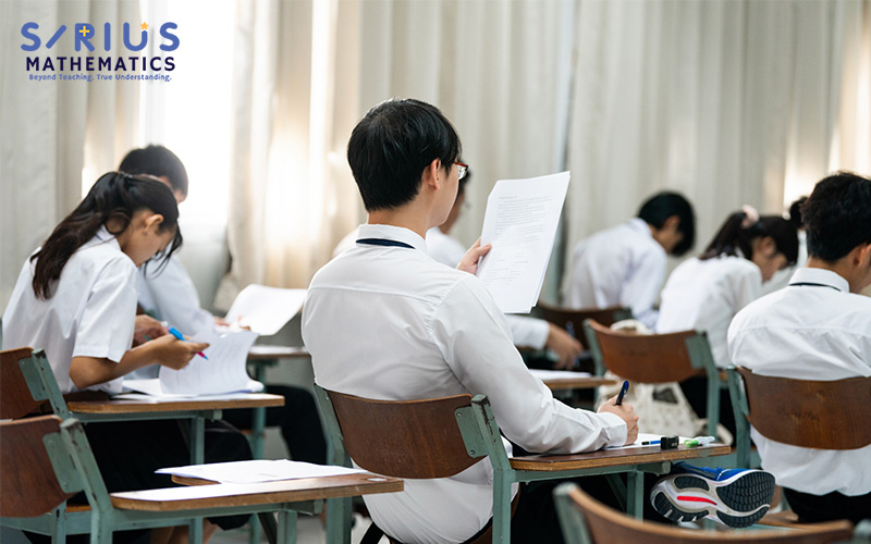 A student looking at their examination paper A student looking at their examination paper