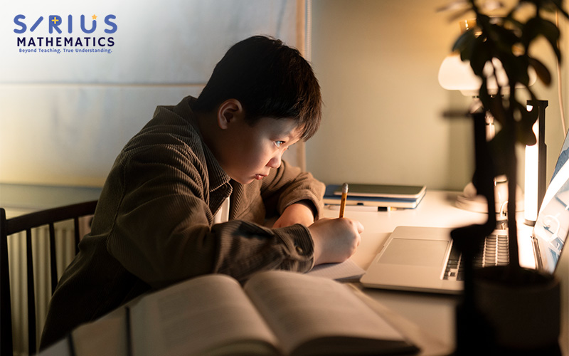 Student studying late for PSLE Math.