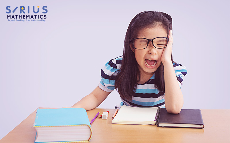 A frustrated student with books and school supplies.