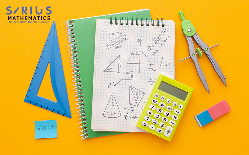 Colorful math tools on yellow background with graph paper showing diagrams and formulas.