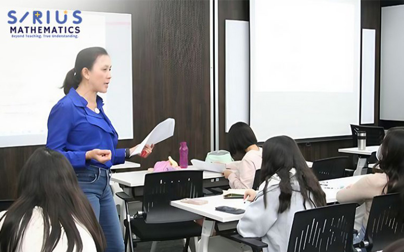 Teacher giving E-Math tuition at Sirius Mathematics.