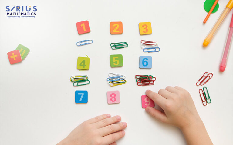 Child learning counting with number blocks and clips.