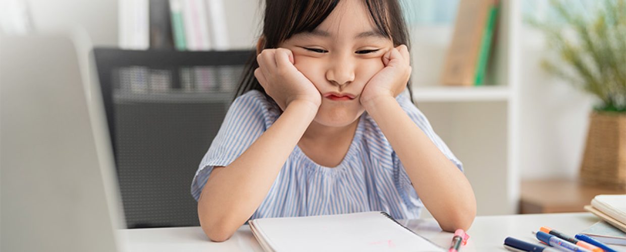 Sirius Mathematics student looking frustrated with math problems.